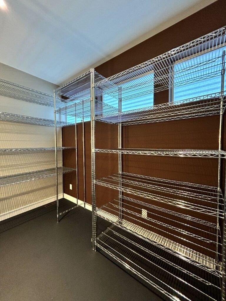 Metal storage shelving installed in a separate Filgap Coffee storage room in Squamish.