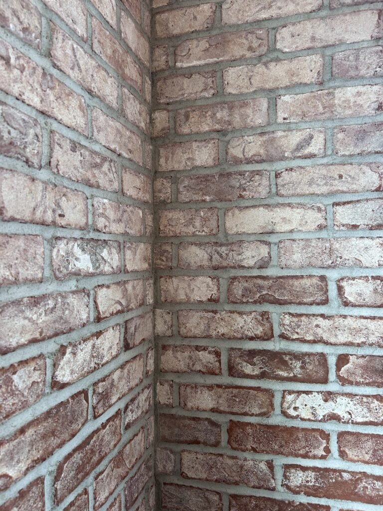 Close-up of brick walls showing the material filling the joints between individual bricks.
