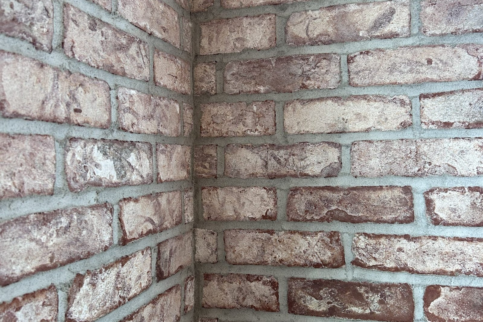 Close-up of brick walls showing the material filling the joints between individual bricks.